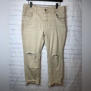 Free People high-rise busted knee skinny jeans with frayed hem